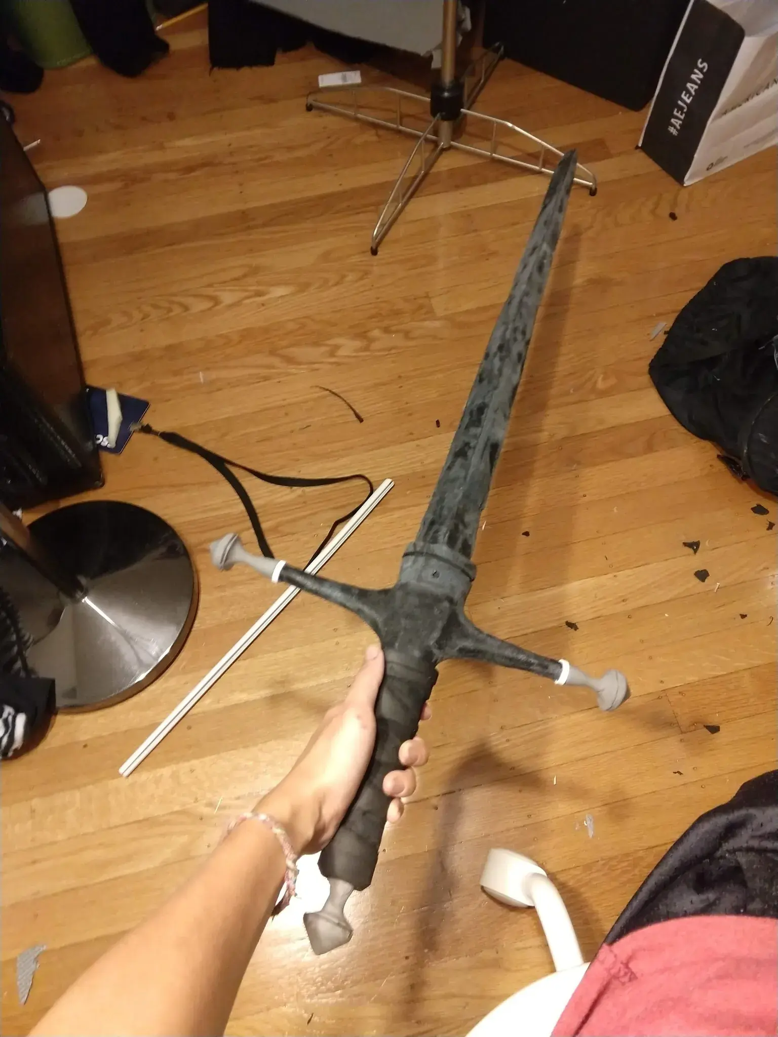 Photograph of a freshly carved foam sword with rough edges covered in worbla