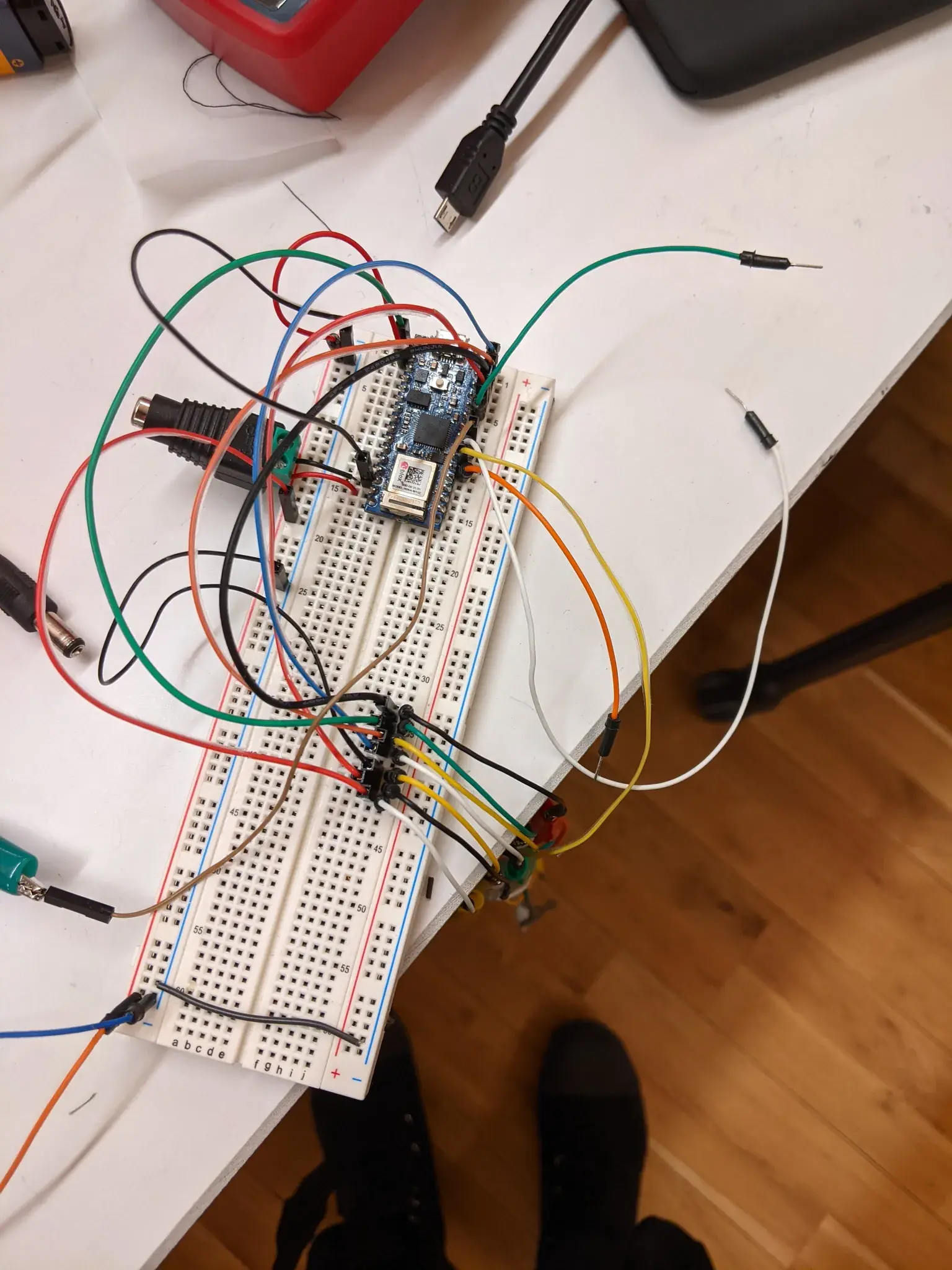 Photograph of jumper wires sticking out of a breadboard