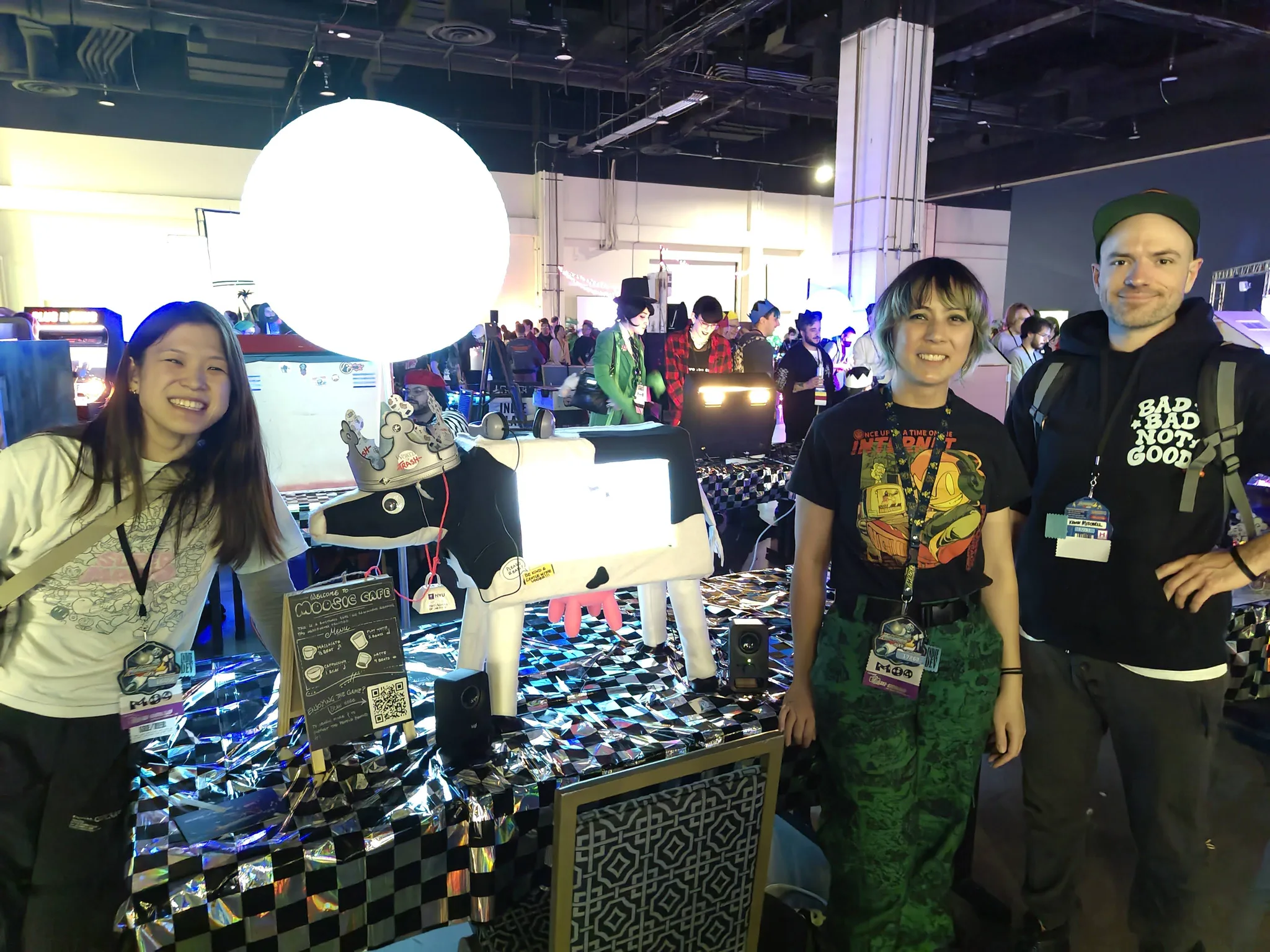 Photograph of the crew posing with the cow at MAGFest